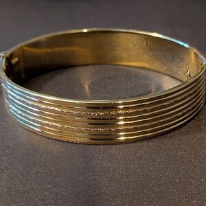 Vintage Monet Yellow Gold Plated Hinge Bracelet With Delicate Scroll Design